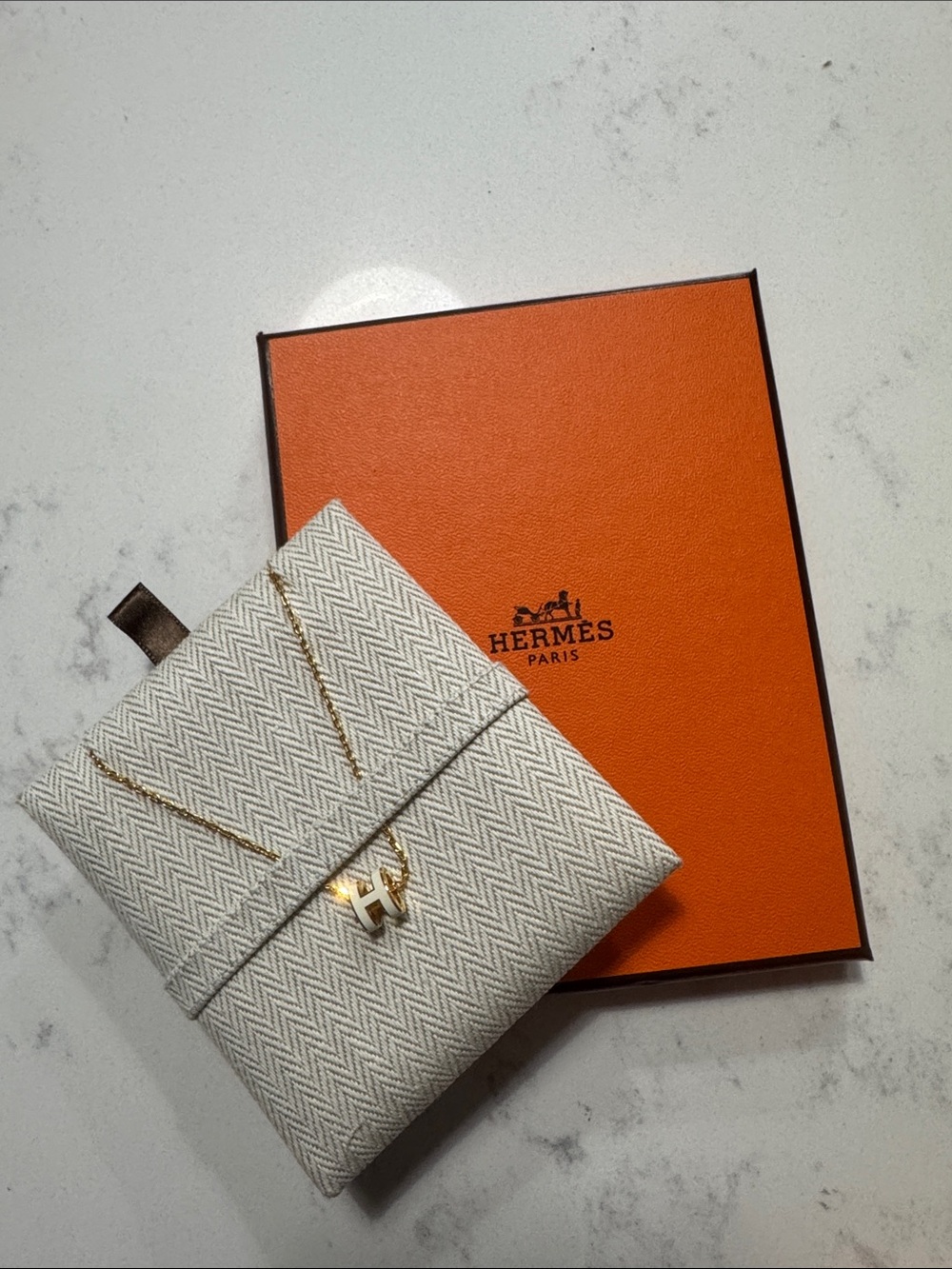 Hermes Gold H Pendant Necklace with White/Cream Pouch